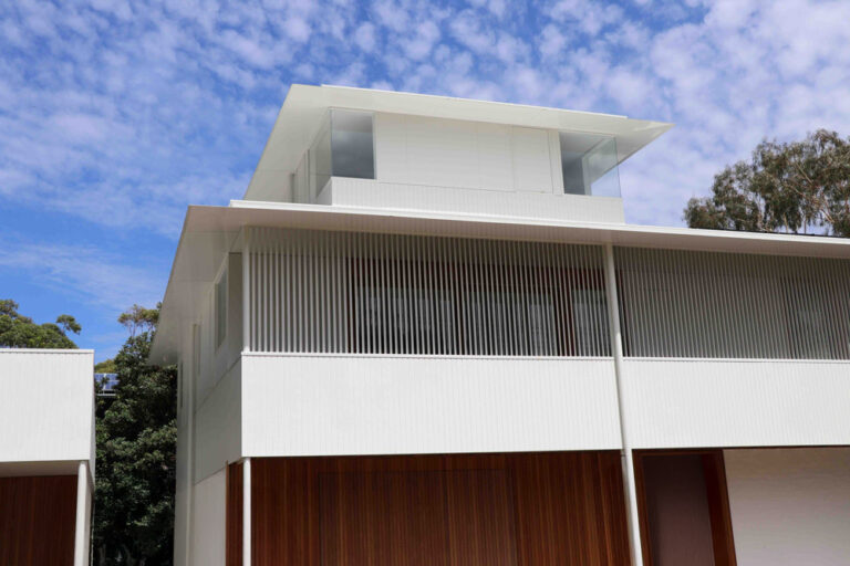 Custom made aluminium sun hoods and privacy screens for architecturally designed home