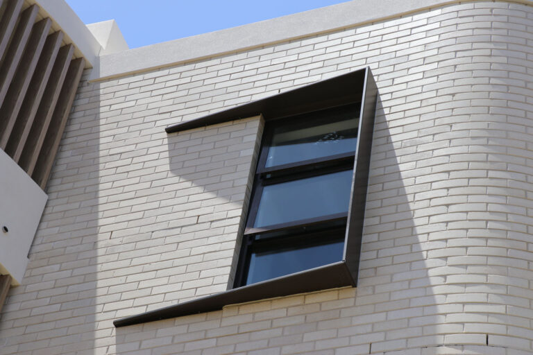 Window shroud made from black architectural metal